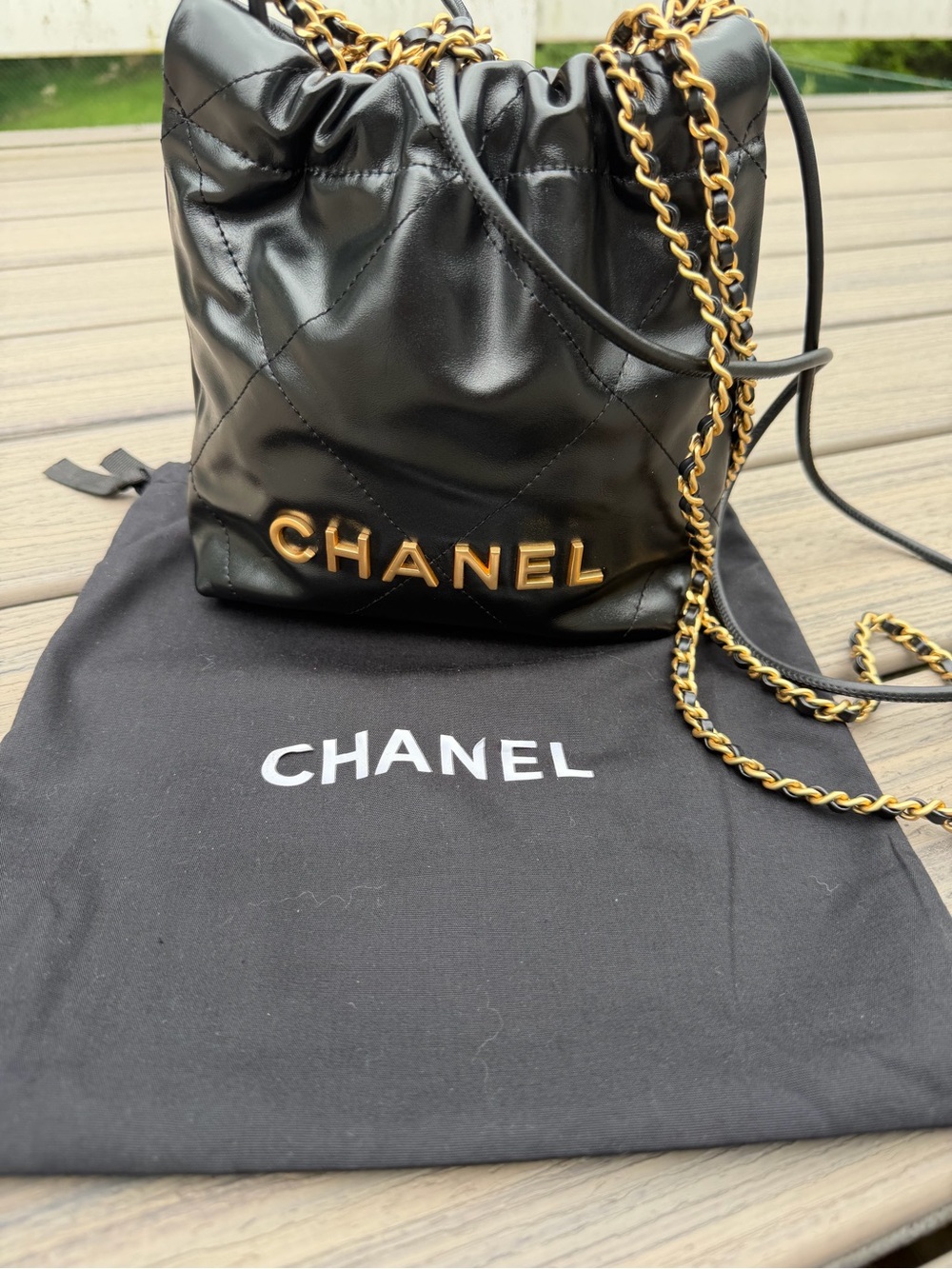 CHANEL Black Quilted Leather Drawstring Crossbody with Gold Chain